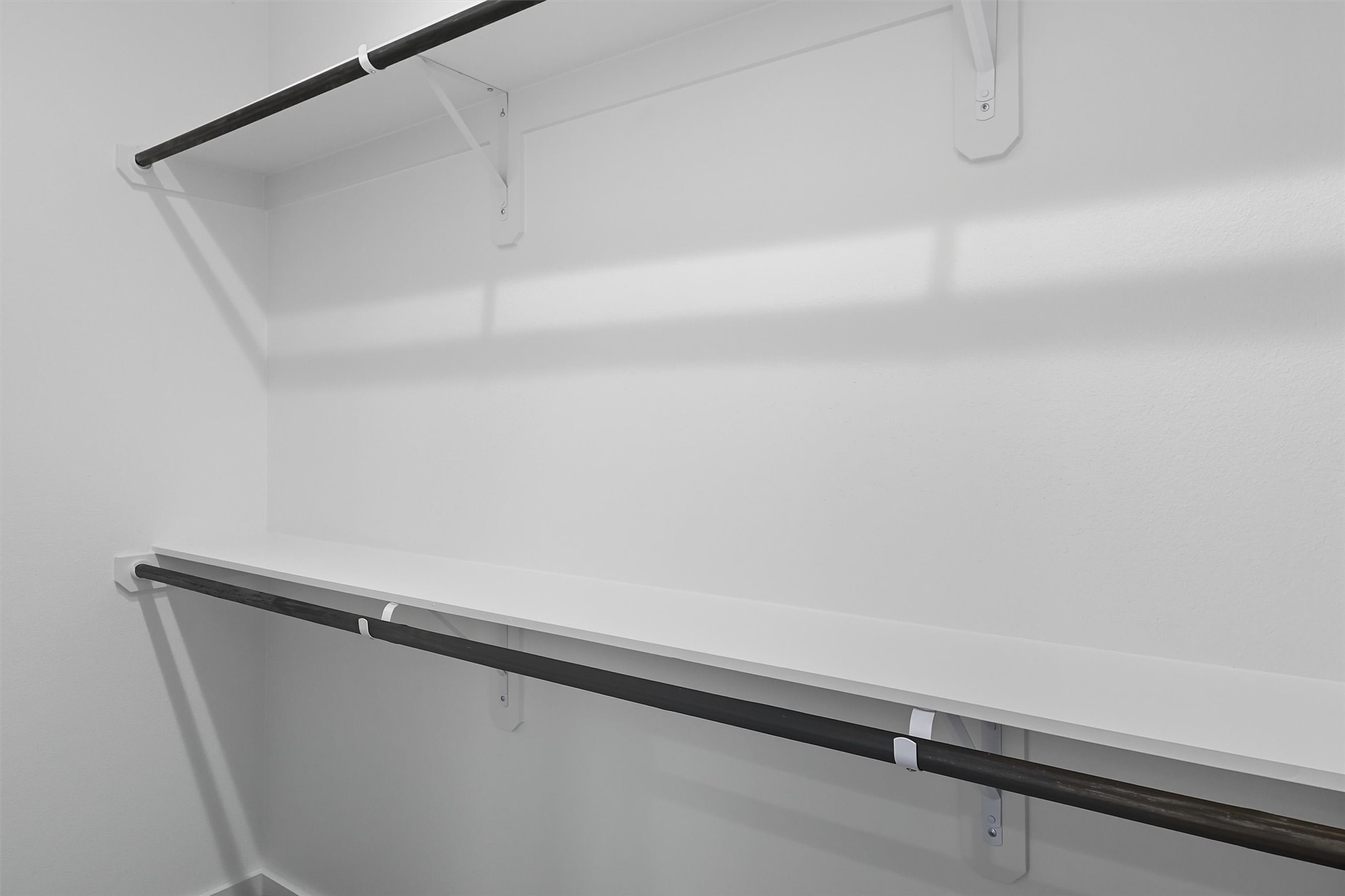 2924 El Fenice Lane Houston, TX 77057 - Photo 29 of 39 a view of a room with racks on the wall