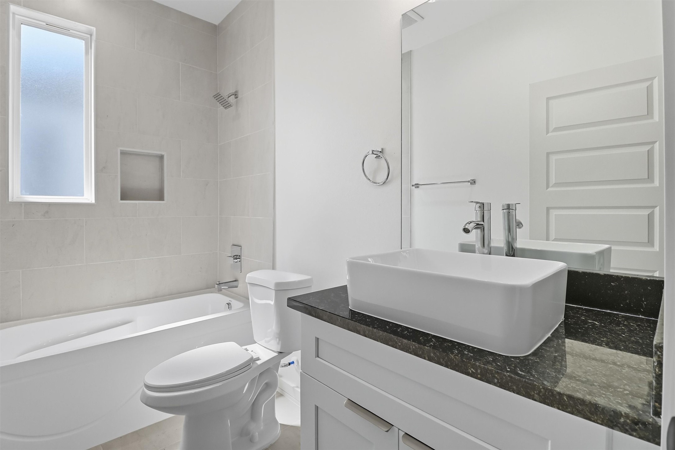 2924 El Fenice Lane Houston, TX 77057 - Photo 34 of 39 a bathroom with a sink a toilet and bathtub