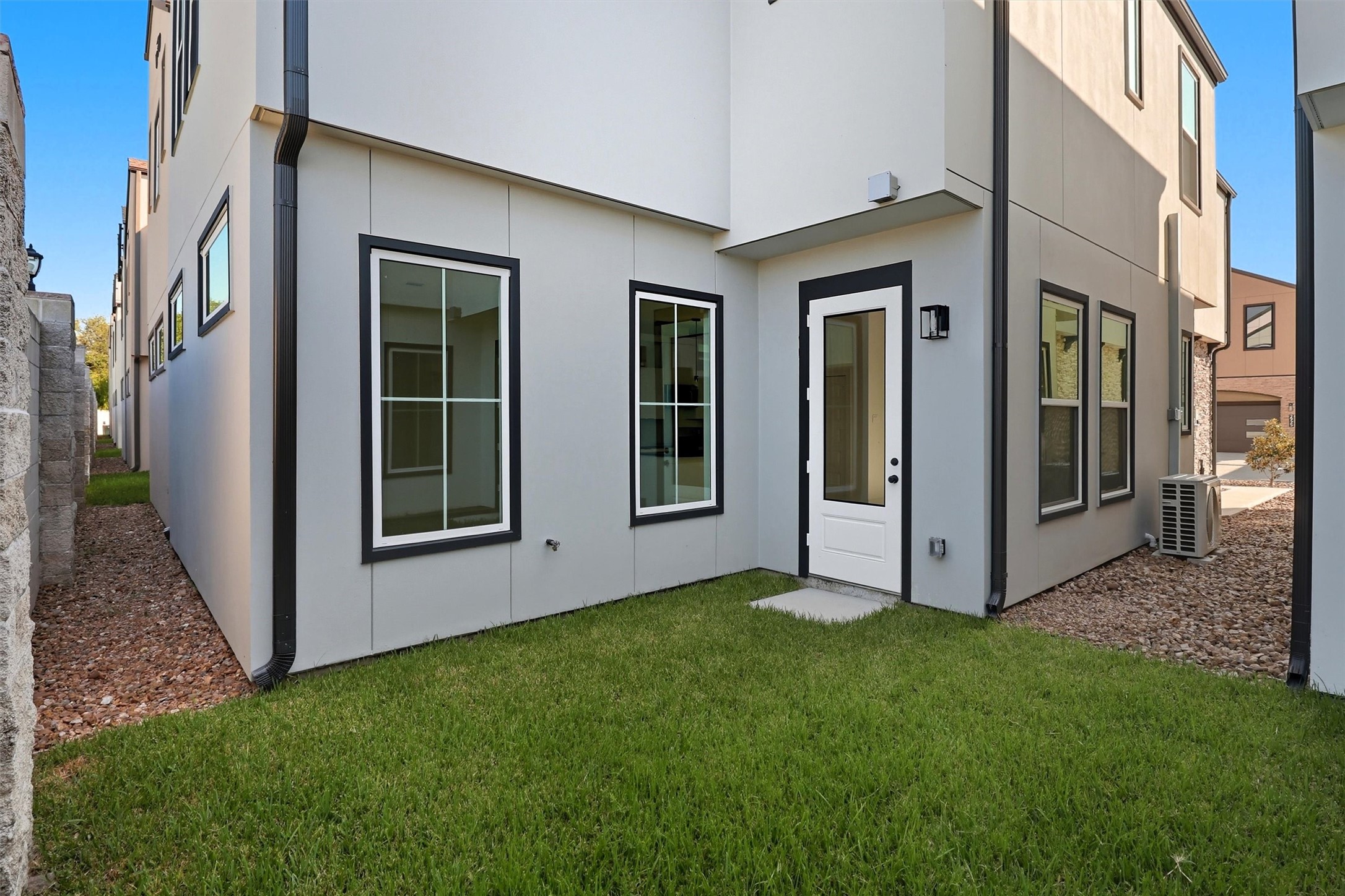 2924 El Fenice Lane Houston, TX 77057 - Photo 36 of 39 Back on the lower level, you’ll find a
beautiful green space. The
community also offers a private park,
walking trails, and ample guest
parking.