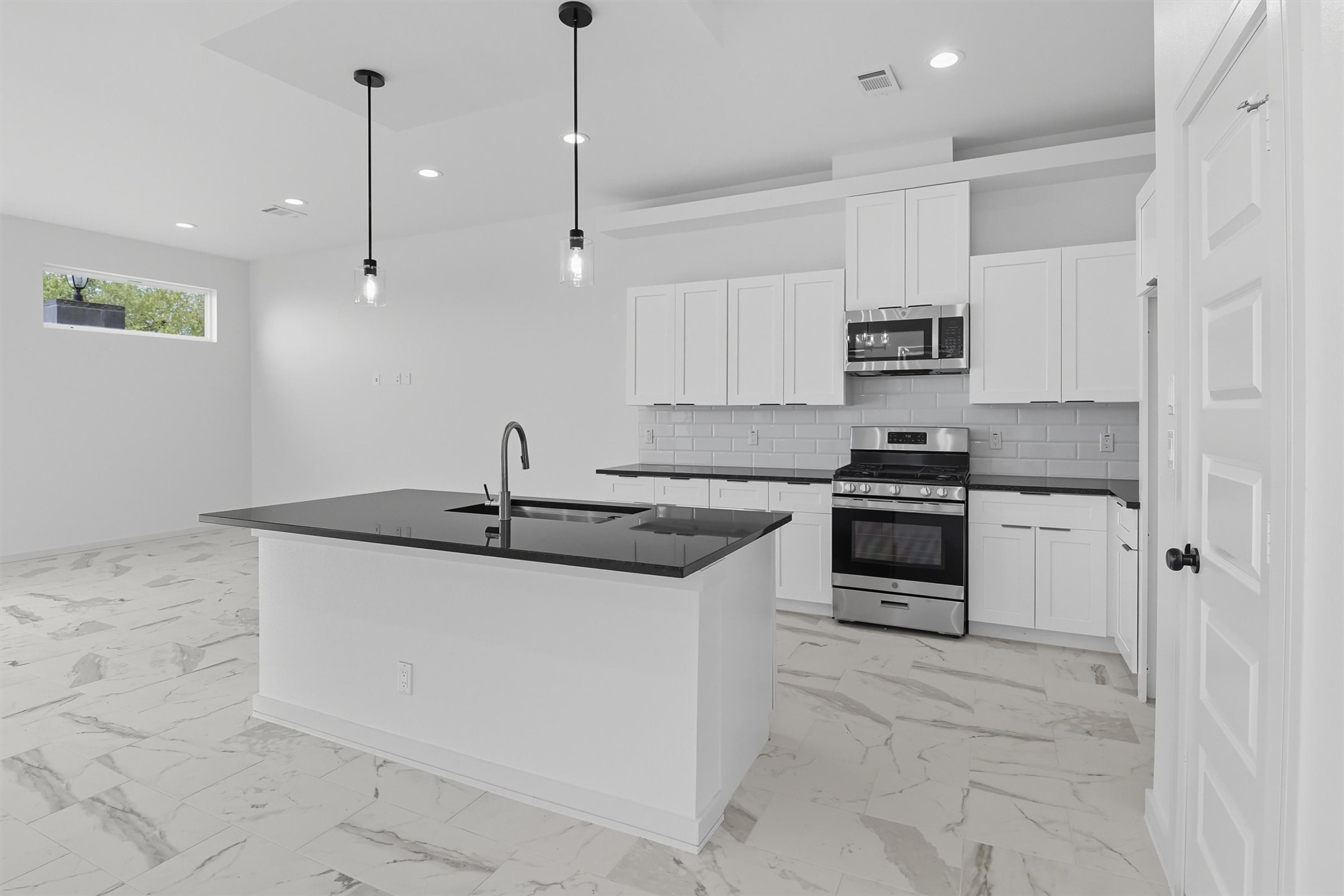 2924 El Fenice Lane Houston, TX 77057 - Photo 8 of 39 a kitchen with stainless steel appliances granite countertop a sink a stove and a refrigerator