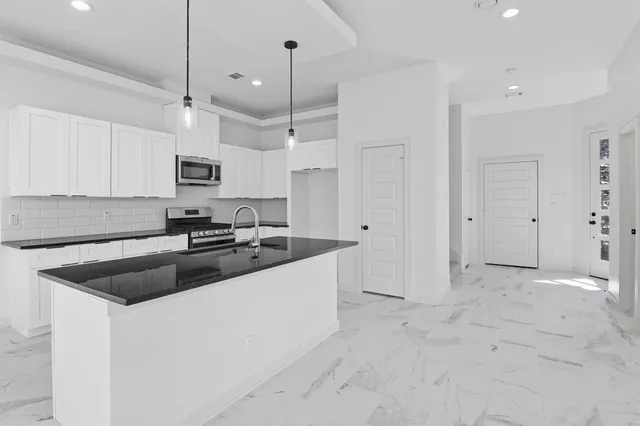 a view of an empty room with a bathroom