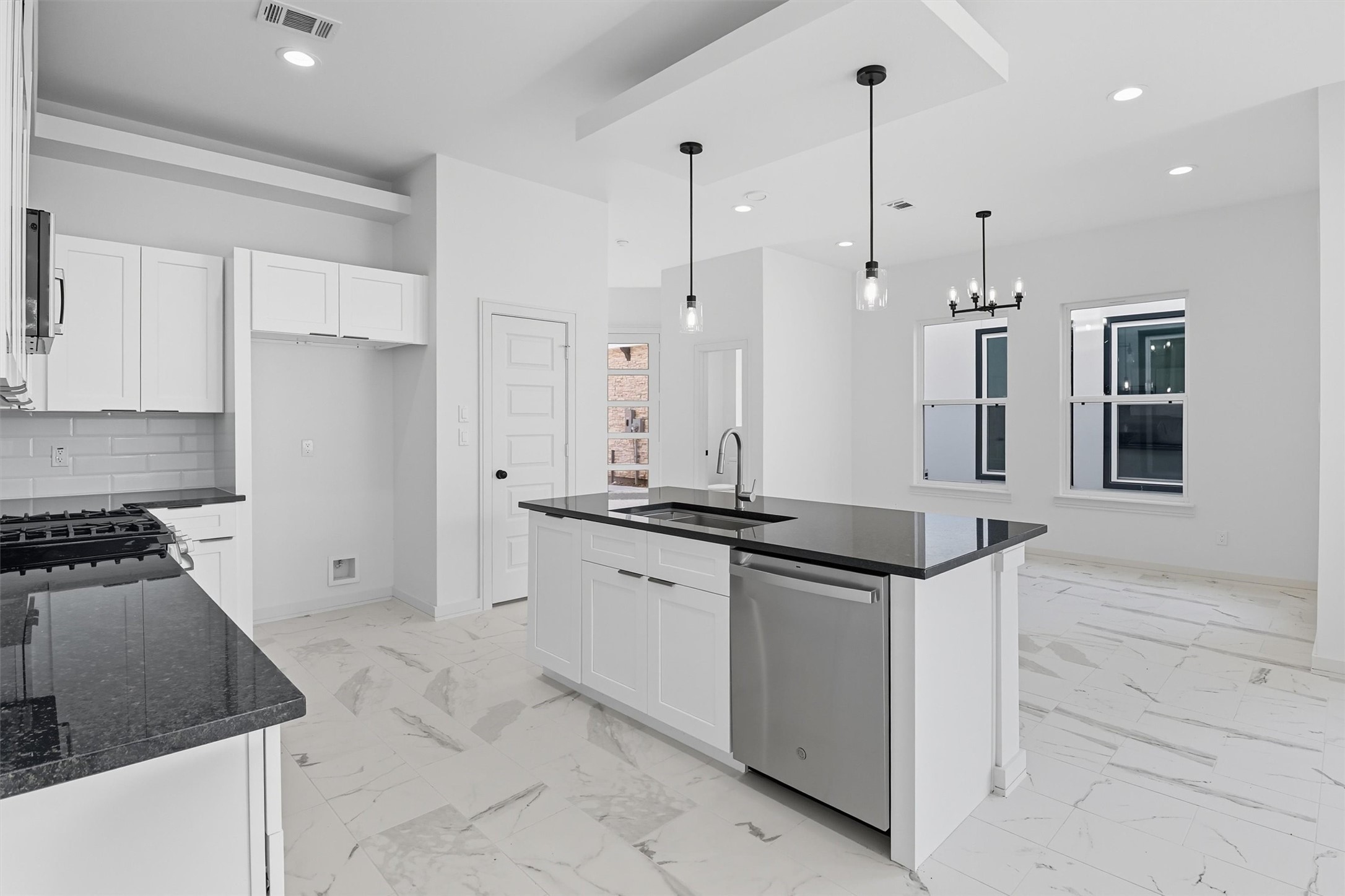 2924 El Fenice Lane Houston, TX 77057 - Photo 10 of 39 a kitchen with stainless steel appliances granite countertop a stove a sink and a refrigerator
