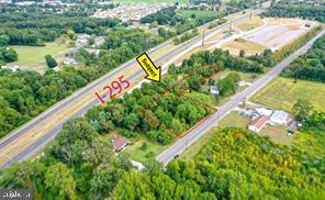 a view of a yard with potted plants