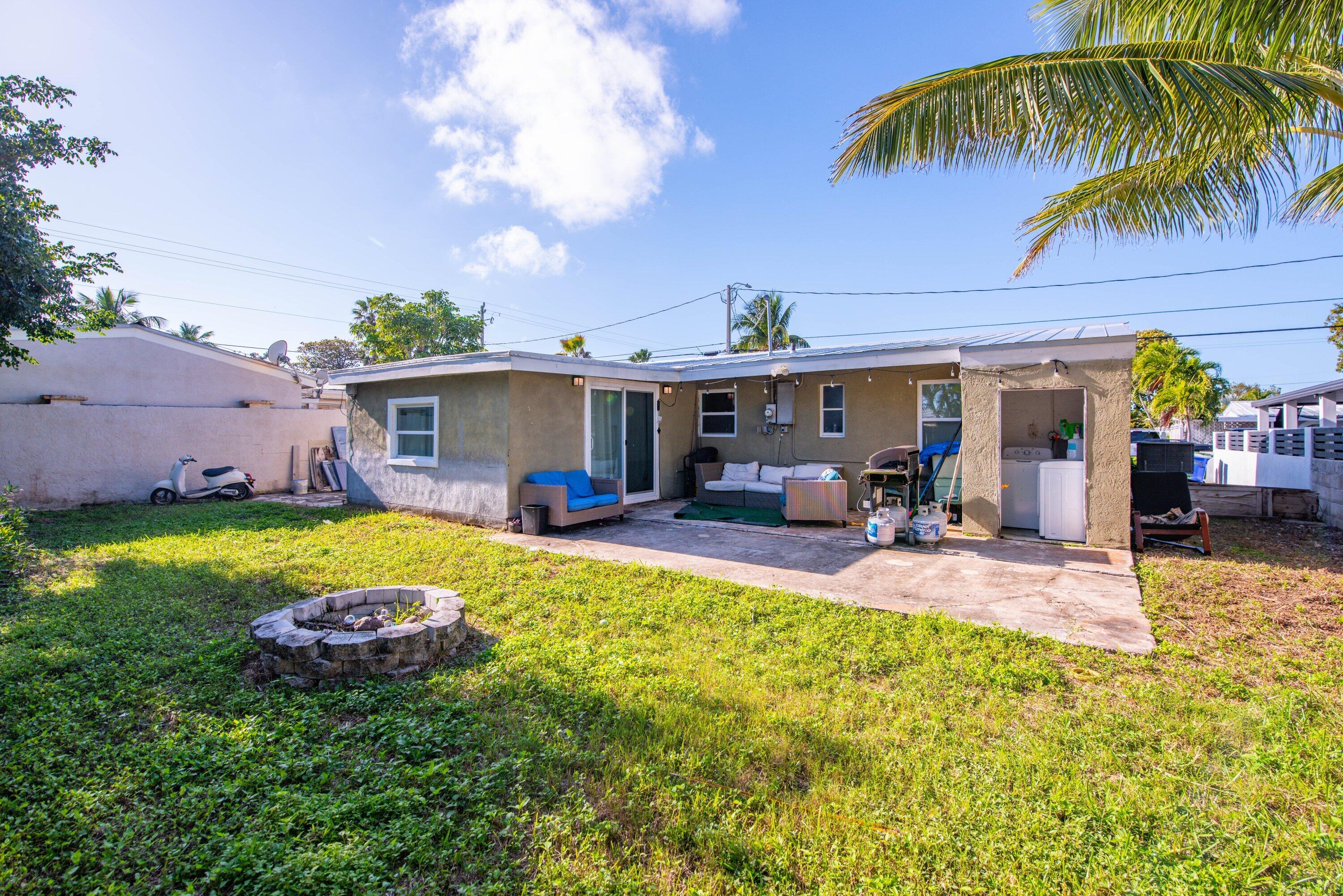 1704 Duncan Street Key West, FL 33040 - Photo 16 of 20 a view of a house with swimming pool and porch with furniture