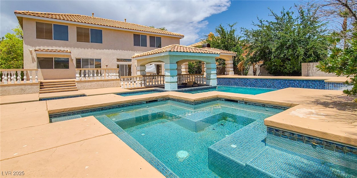 4100 Highland Castle Court Las Vegas, NV 89129 - Photo 2 of 49 View of pool featuring a patio, an in-ground hot tub, and a gazebo