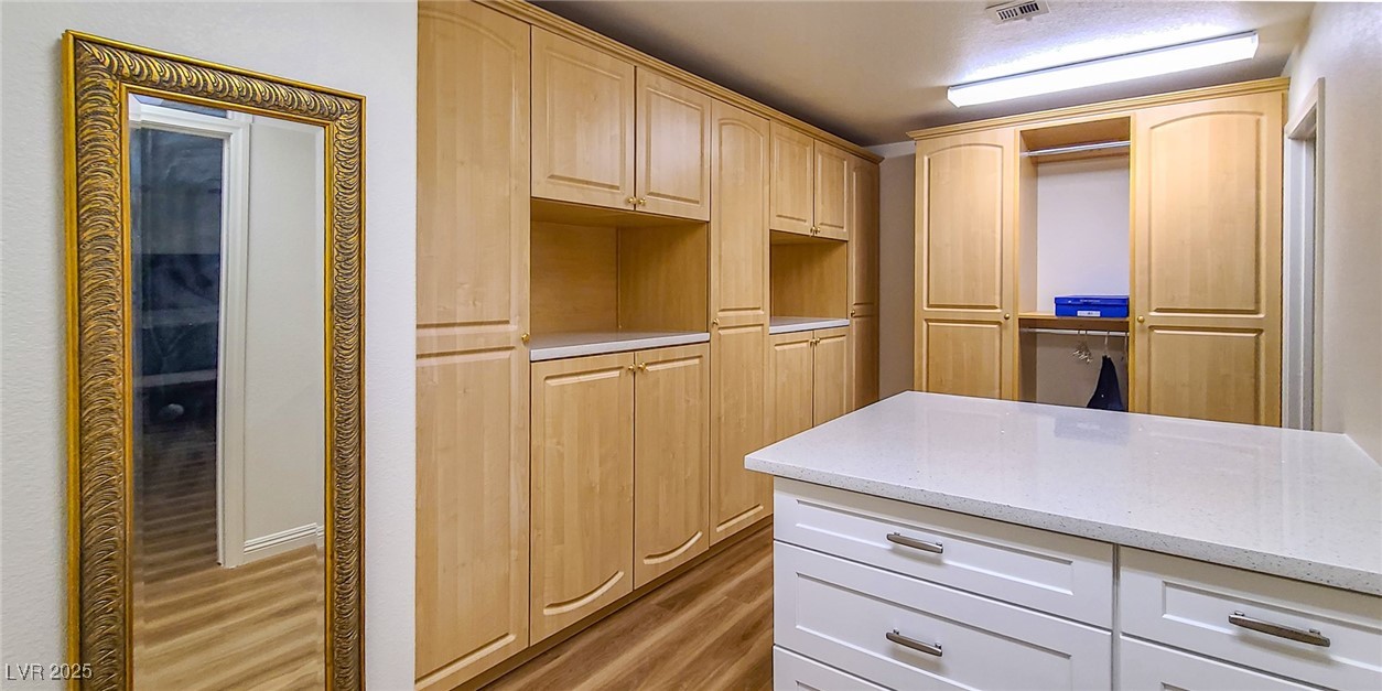 4100 Highland Castle Court Las Vegas, NV 89129 - Photo 25 of 49 Spacious closet featuring dark wood-style flooring