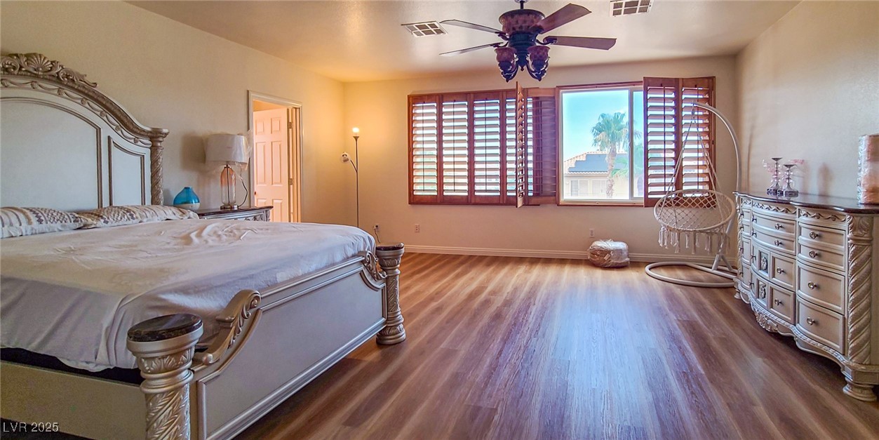 4100 Highland Castle Court Las Vegas, NV 89129 - Photo 28 of 49 Bedroom featuring wood finished floors and ceiling fan