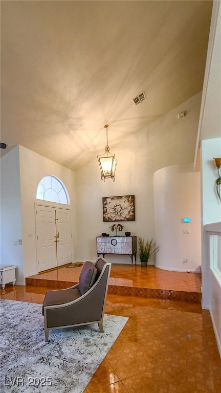 4100 Highland Castle Court Las Vegas, NV 89129 - Photo 36 of 49 Foyer featuring light tile patterned floors and vaulted ceiling