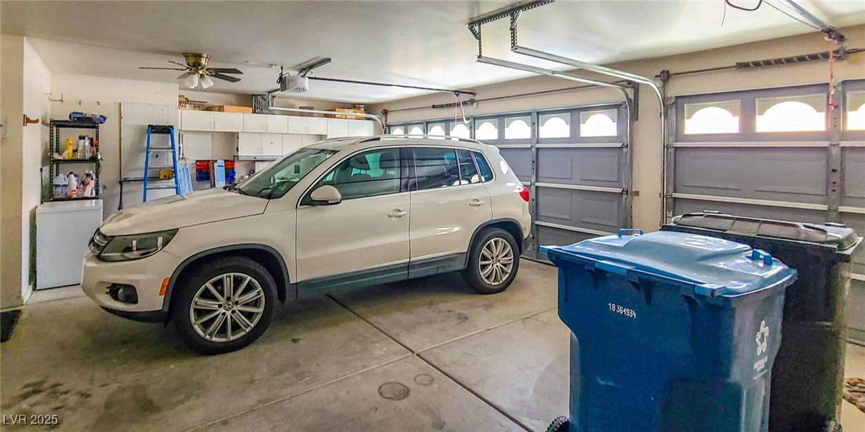 4100 Highland Castle Court Las Vegas, NV 89129 - Photo 10 of 49 Garage with white fridge