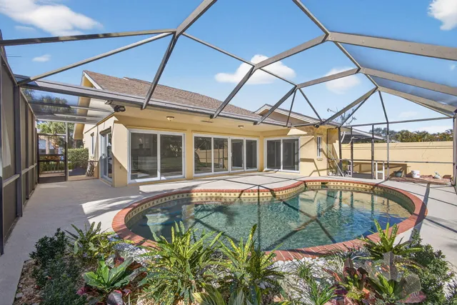 a view of a swimming pool with a patio