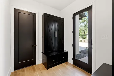 a bedroom with a bed and a mirror