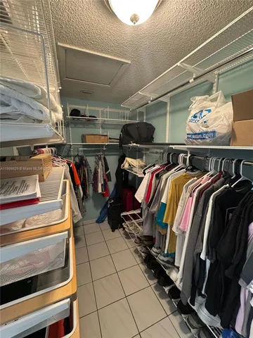 a kitchen with a refrigerator sink and cabinets