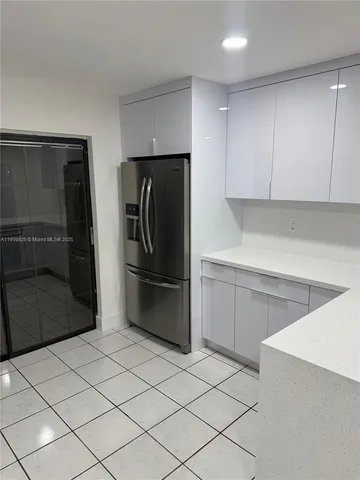 a bathroom with a glass door shower