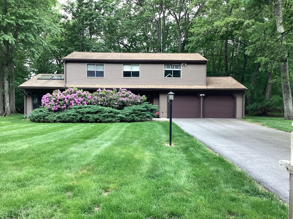 a front view of house with garden