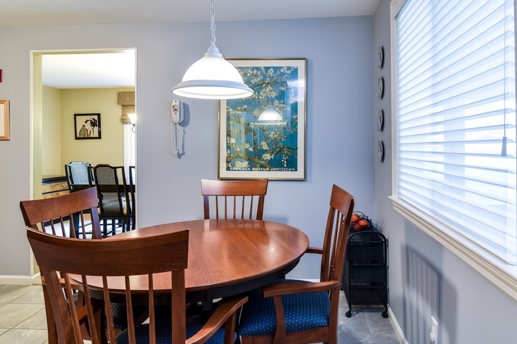 38 Stagecoach Drive Ashland, MA 01721 - Photo 12 of 29 a view of a dining room with furniture window and outside view