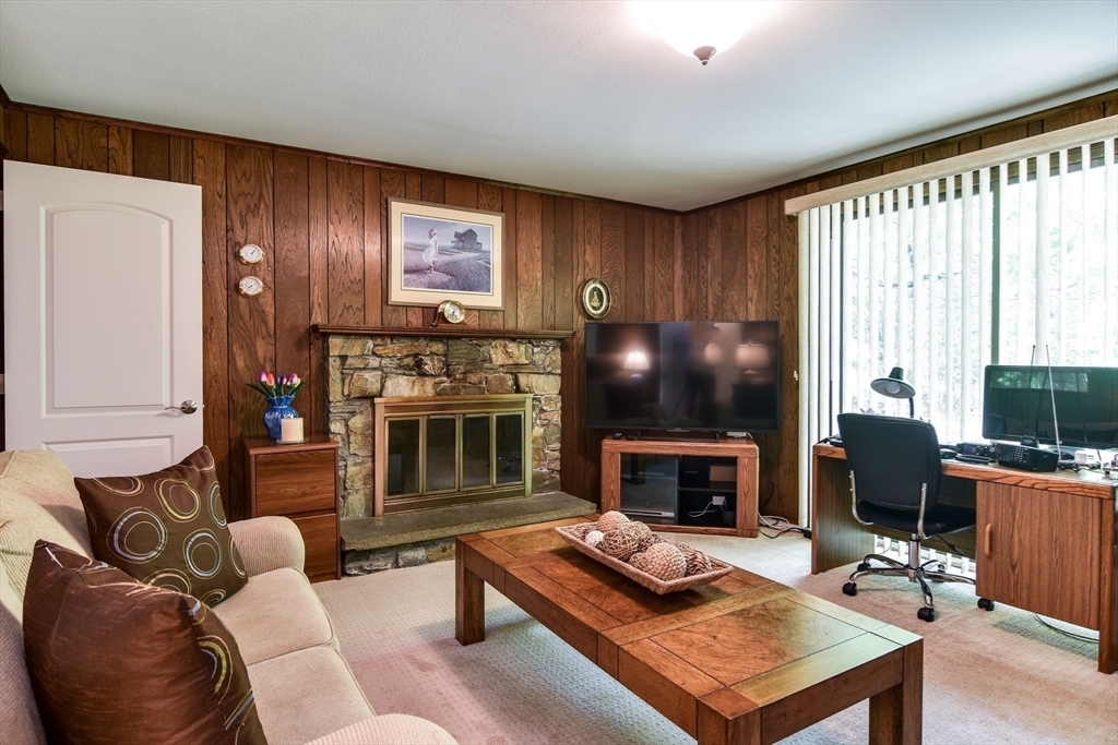 38 Stagecoach Drive Ashland, MA 01721 - Photo 13 of 29 a living room with furniture a fireplace and a window