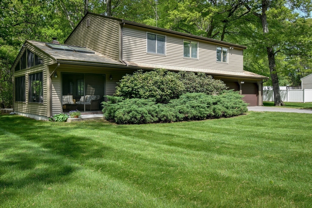 38 Stagecoach Drive Ashland, MA 01721 - Photo 2 of 29 a front view of a house with a garden