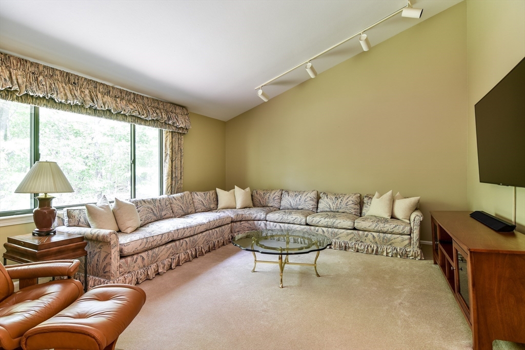 38 Stagecoach Drive Ashland, MA 01721 - Photo 21 of 29 a living room with furniture and a flat screen tv