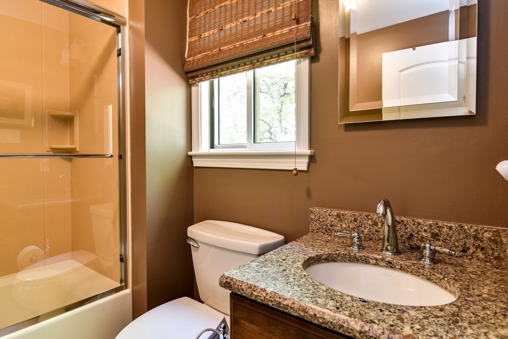 38 Stagecoach Drive Ashland, MA 01721 - Photo 23 of 29 a bathroom with a granite countertop sink toilet and shower