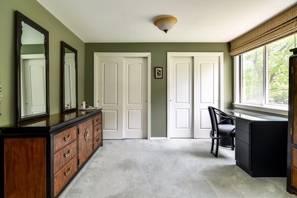 38 Stagecoach Drive Ashland, MA 01721 - Photo 25 of 29 a view of a hallway with furniture and windows