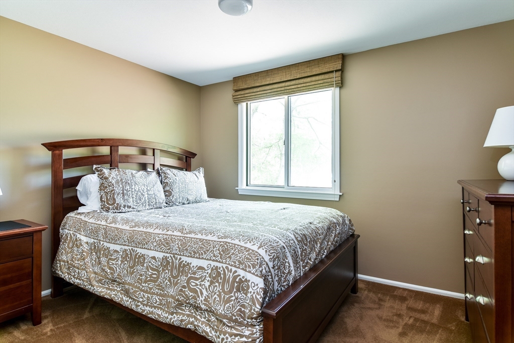 38 Stagecoach Drive Ashland, MA 01721 - Photo 27 of 29 a bedroom with a bed and window