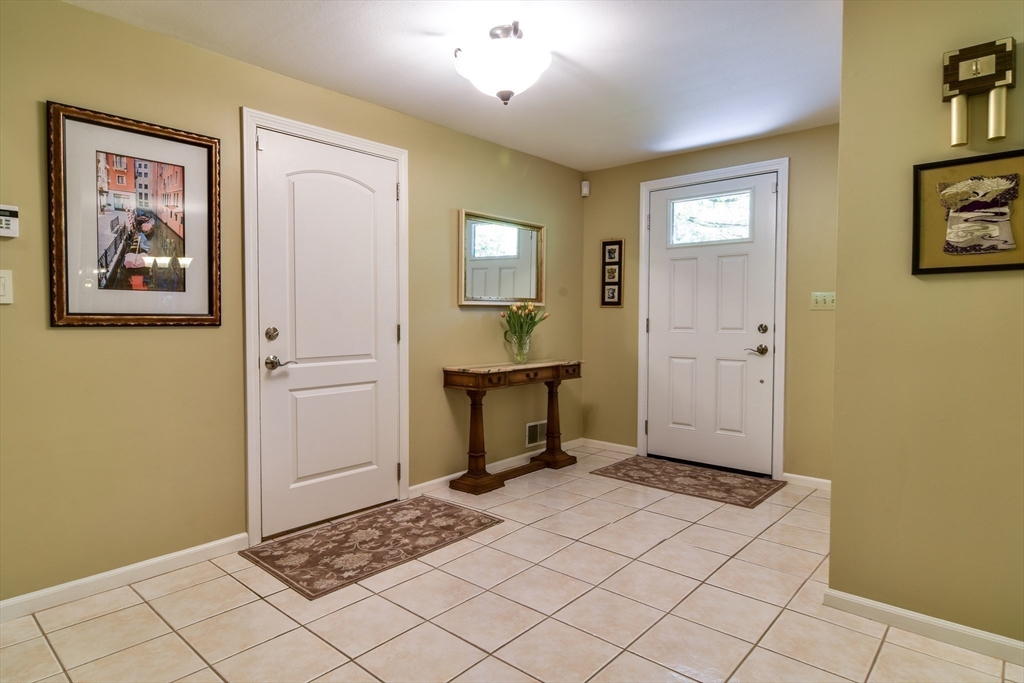 38 Stagecoach Drive Ashland, MA 01721 - Photo 6 of 29 a view of a hallway with front door