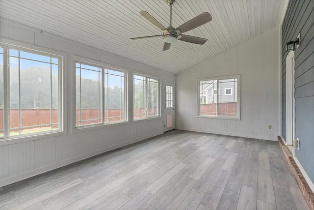a view of a garage with rack and bicycle
