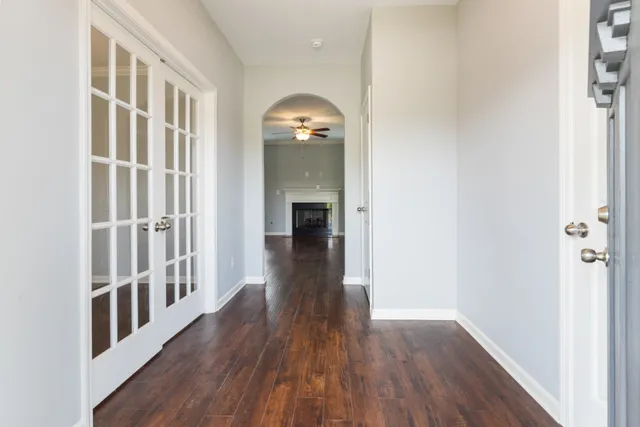 a view of a hallway view with wooden floor and staircase