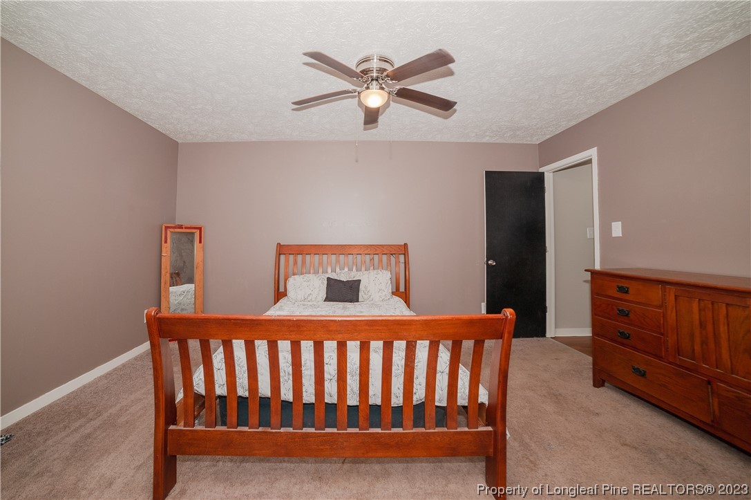 6005 Dalton Road Fayetteville, NC 28314 - Photo 27 of 44 a bedroom with a bed and window