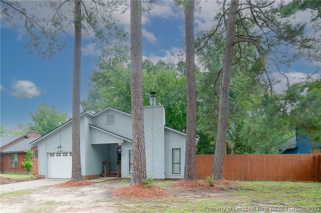 6005 Dalton Road Fayetteville, NC 28314 - Photo 3 of 44 a view of a house with a yard and garage