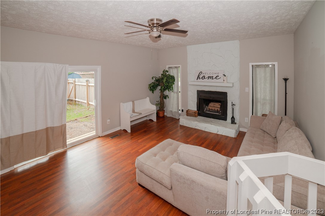 6005 Dalton Road Fayetteville, NC 28314 - Photo 8 of 44 a living room with furniture and a fireplace