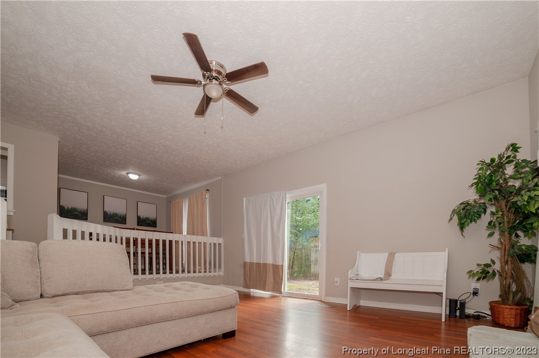 6005 Dalton Road Fayetteville, NC 28314 - Photo 10 of 44 a living room with furniture and a potted plant