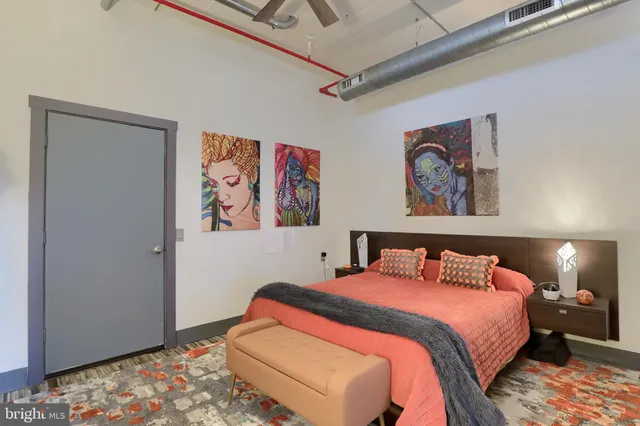 a bedroom with a bed and a dresser