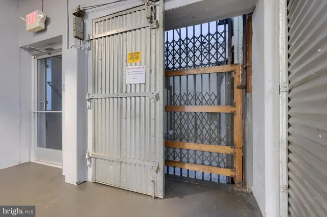 a kitchen with refrigerator and cabinets
