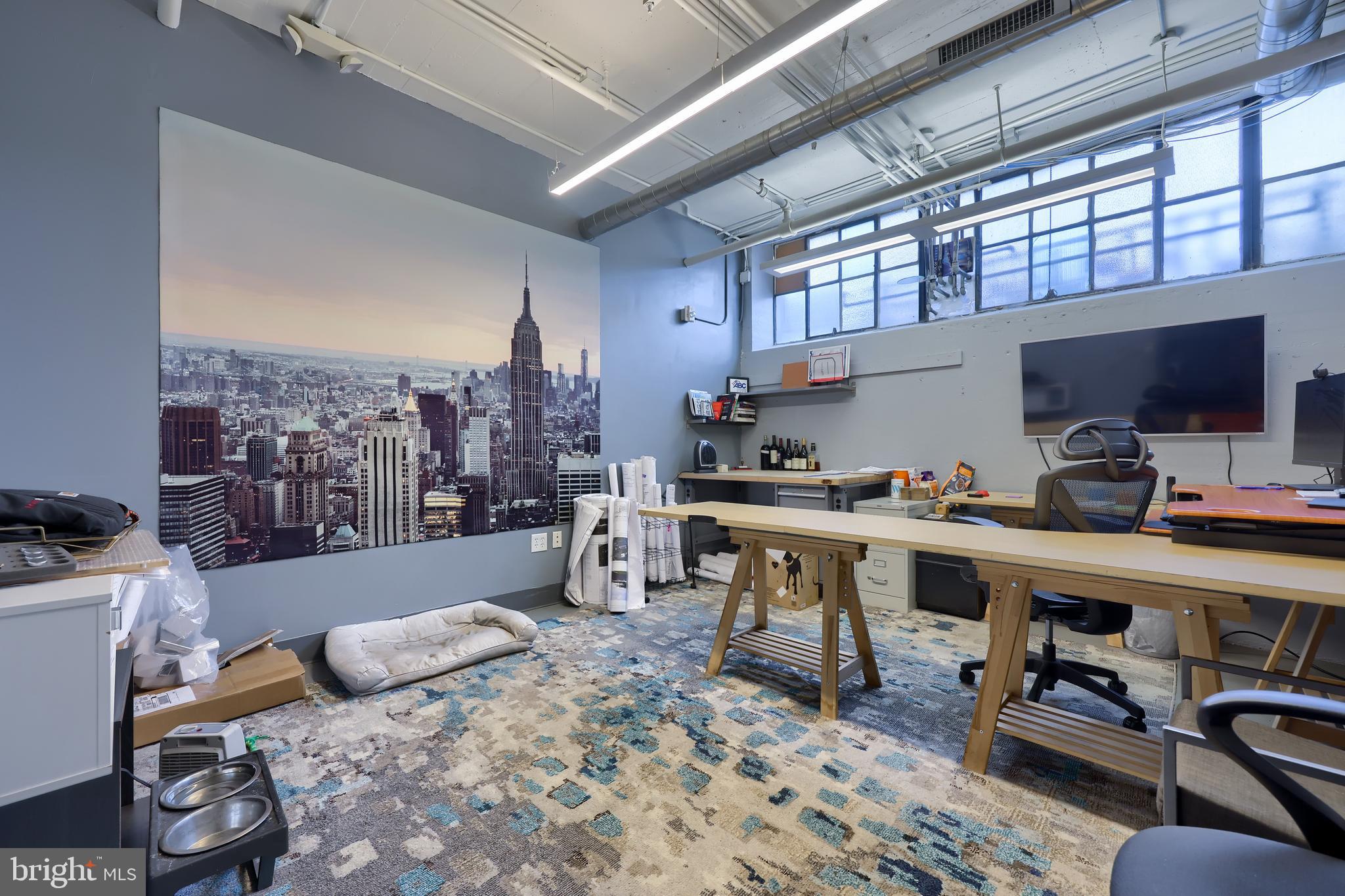 31 South Sterley Street, Unit 101 Shillington, PA 19607 - Photo 33 of 39 a living room with furniture a flat screen tv and kitchen view