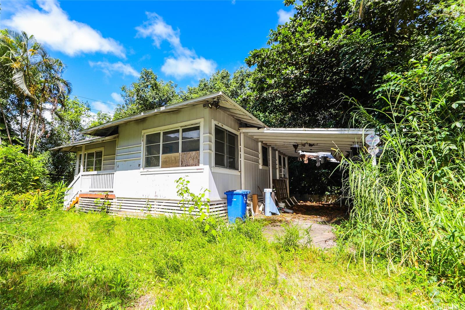 47-270 Ahuimanu Road Kaneohe, HI 96744 - Photo 4 of 25 a view of a house with a yard patio and a garden