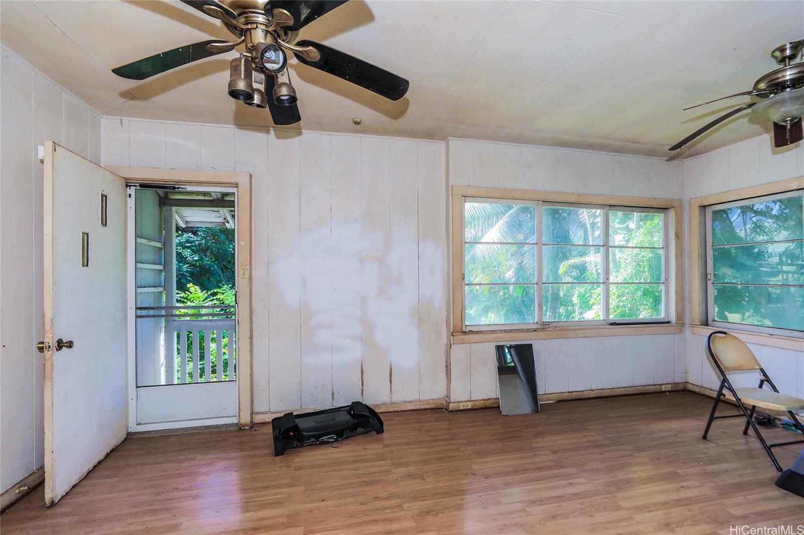 47-270 Ahuimanu Road Kaneohe, HI 96744 - Photo 5 of 25 a view of a livingroom with a window and wooden floor