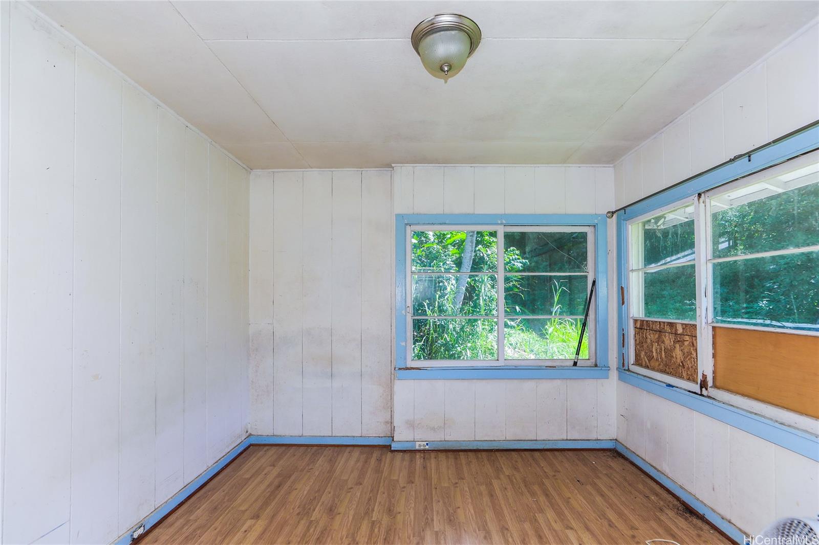 47-270 Ahuimanu Road Kaneohe, HI 96744 - Photo 8 of 25 a view of room with window and wooden floor