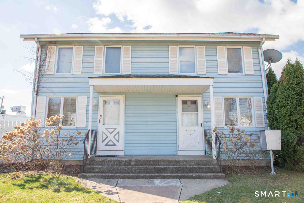 10 Maple Street, Unit A2 Plainville, CT 06062 - Photo 1 of 1 a front view of a house with garden
