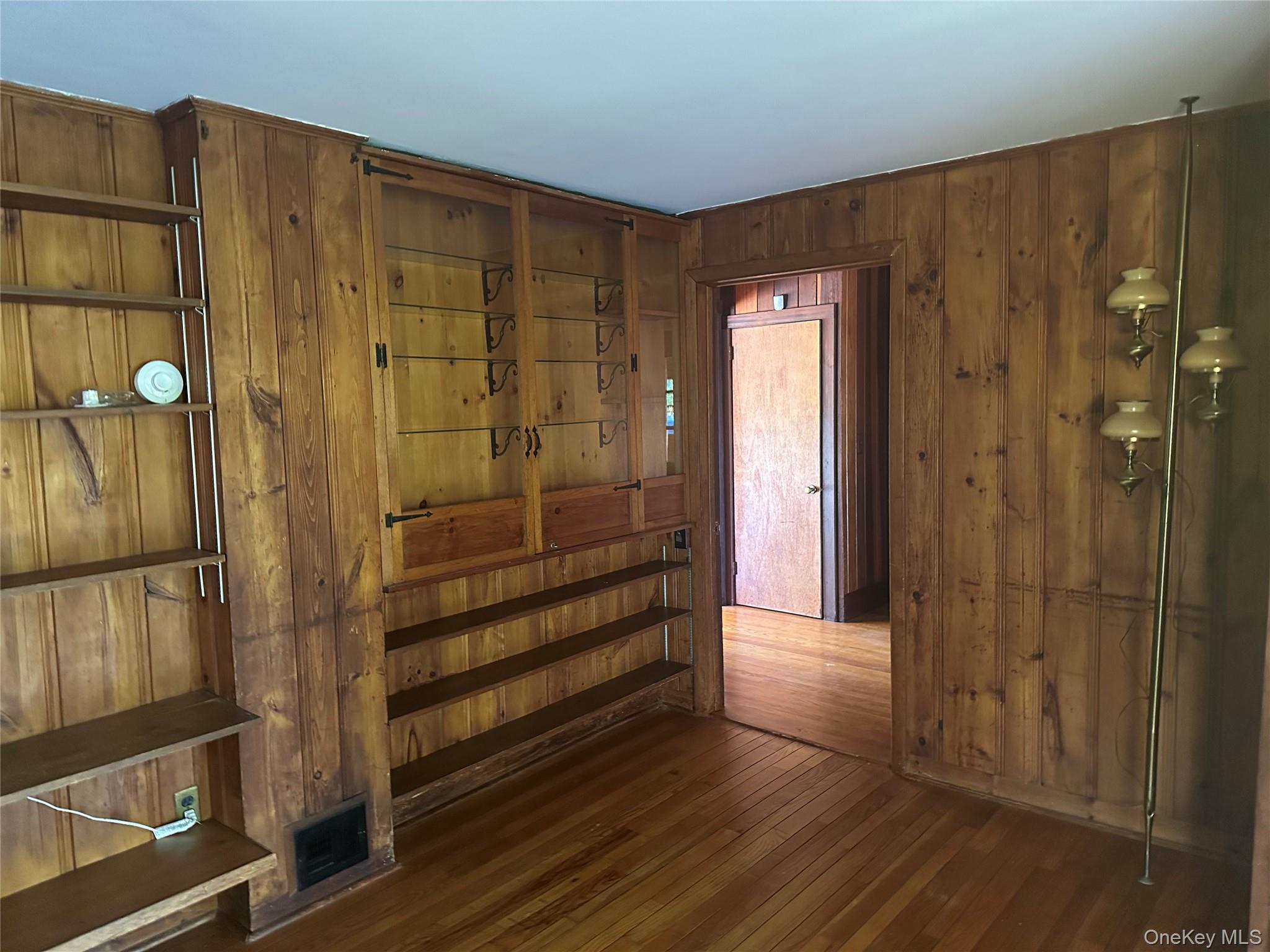 376 Lane Gate Road Cold Spring, NY 10516 - Photo 12 of 23 a view of a hallway with wooden floor and staircase