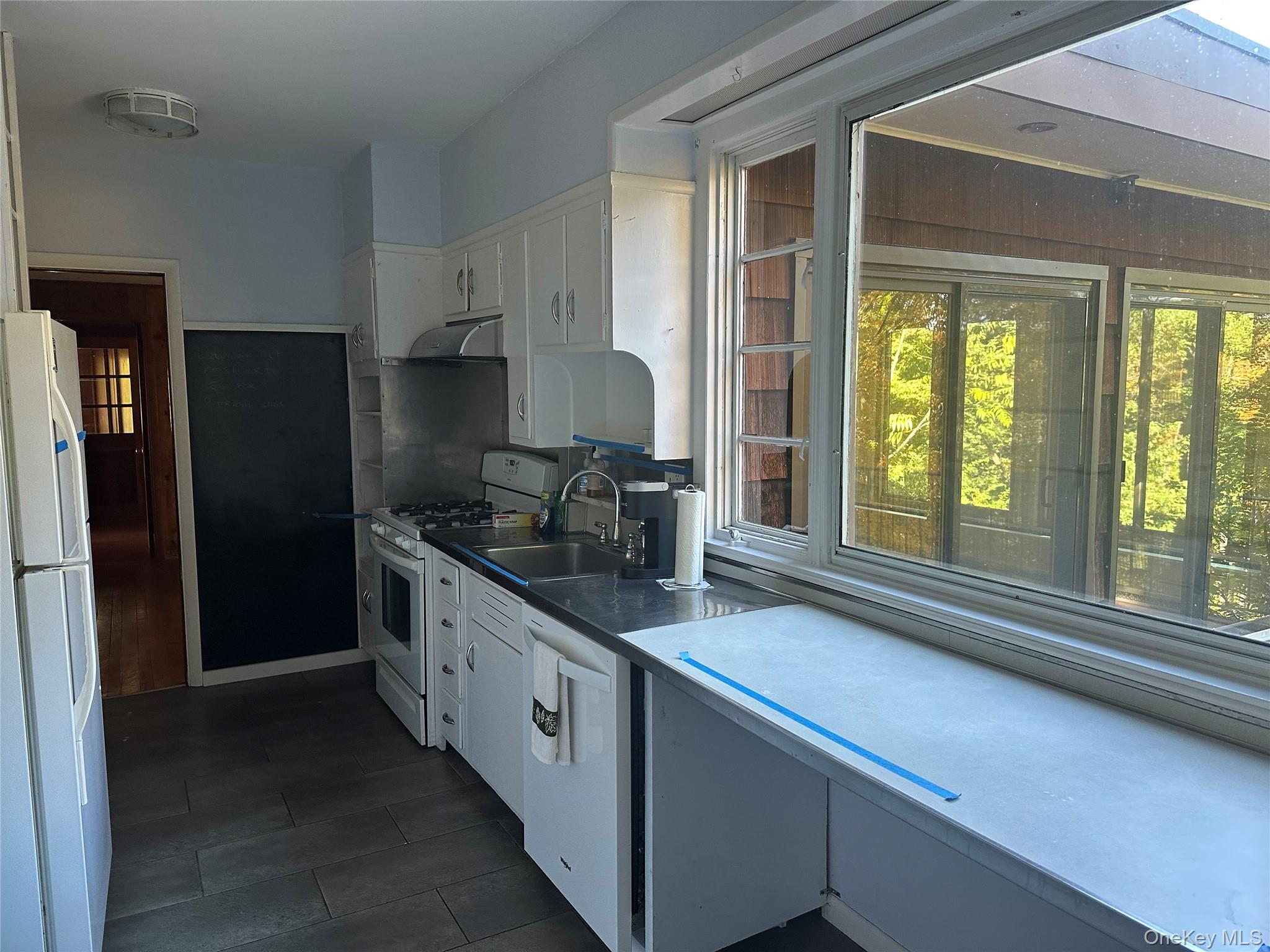 376 Lane Gate Road Cold Spring, NY 10516 - Photo 15 of 23 a kitchen with stainless steel appliances a sink and a large window