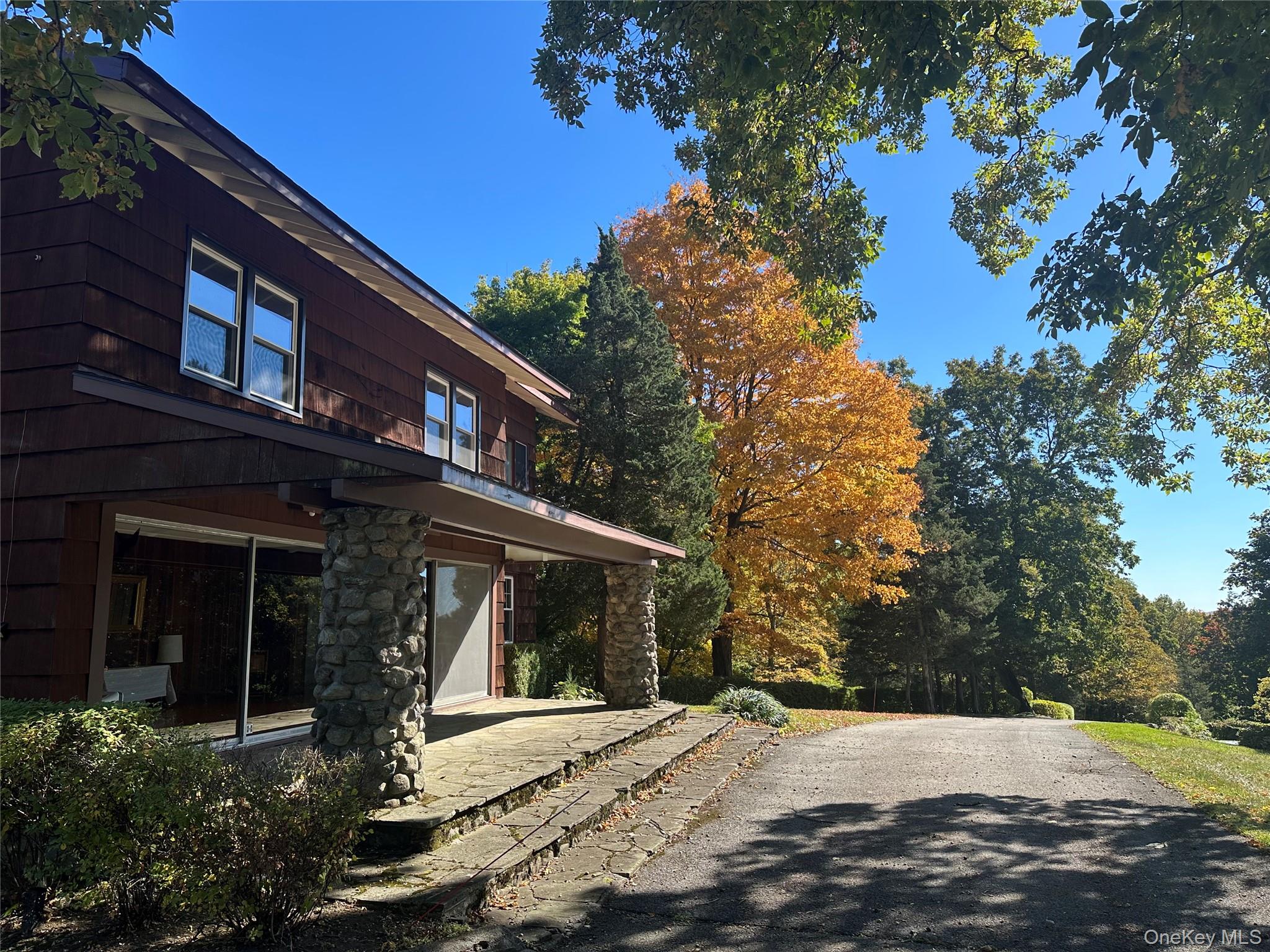 376 Lane Gate Road Cold Spring, NY 10516 - Photo 6 of 23 a front view of a house with a yard