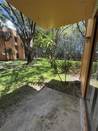 a view of backyard with green space