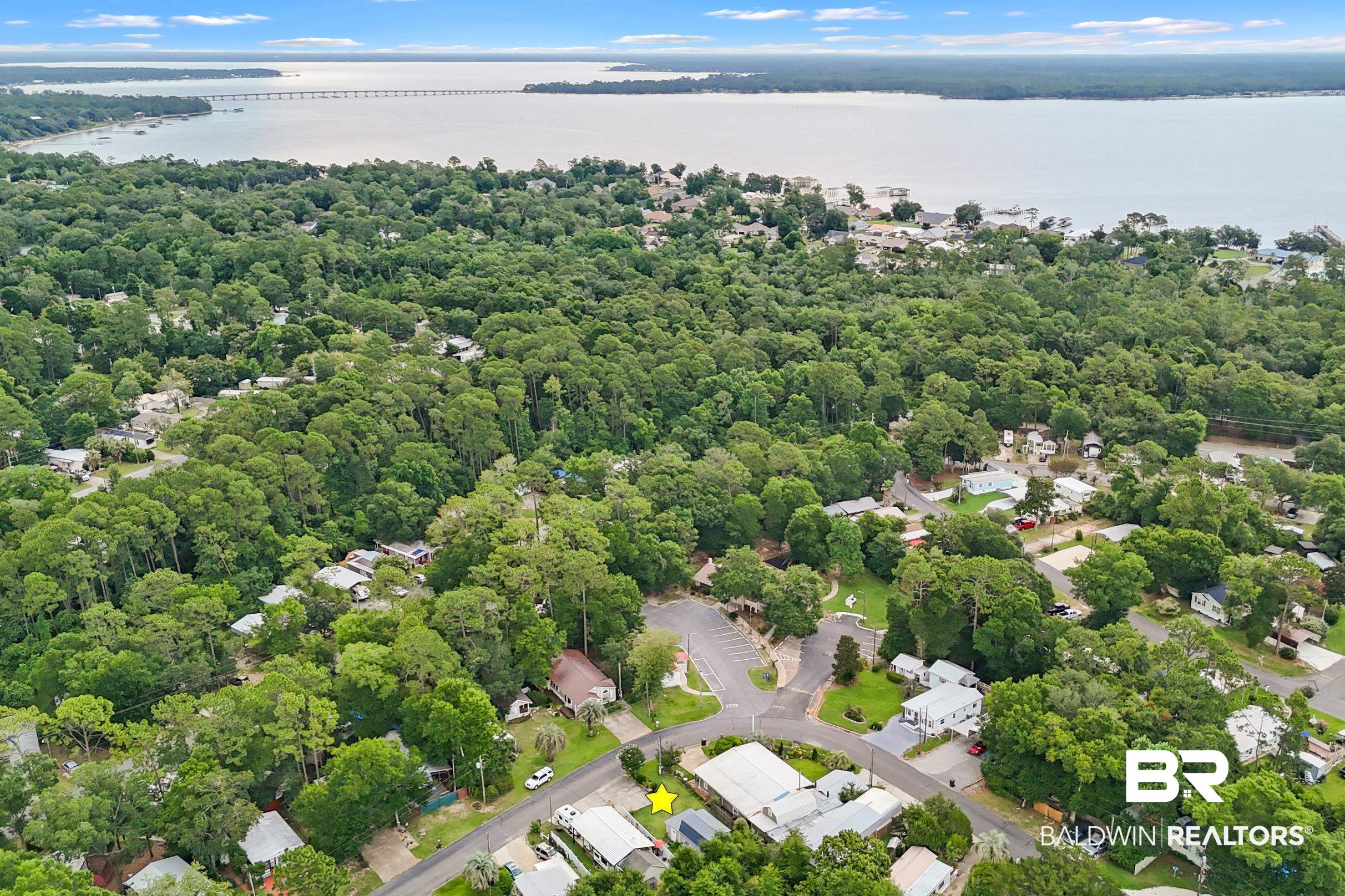 496 Elberta Loop Lillian, AL 36549 - Photo 25 of 29 Aerial view of a large body of water