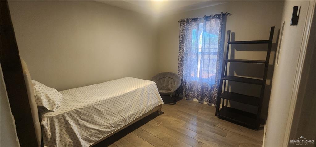 118 Keystone Street Mission, TX 78572 - Photo 11 of 11 a bedroom with a bed and a walk in closet