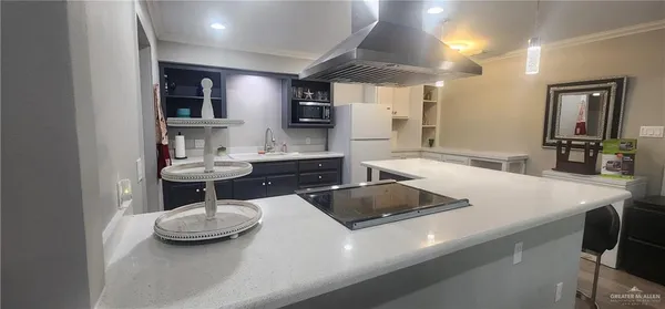 a kitchen with a table chairs and stove