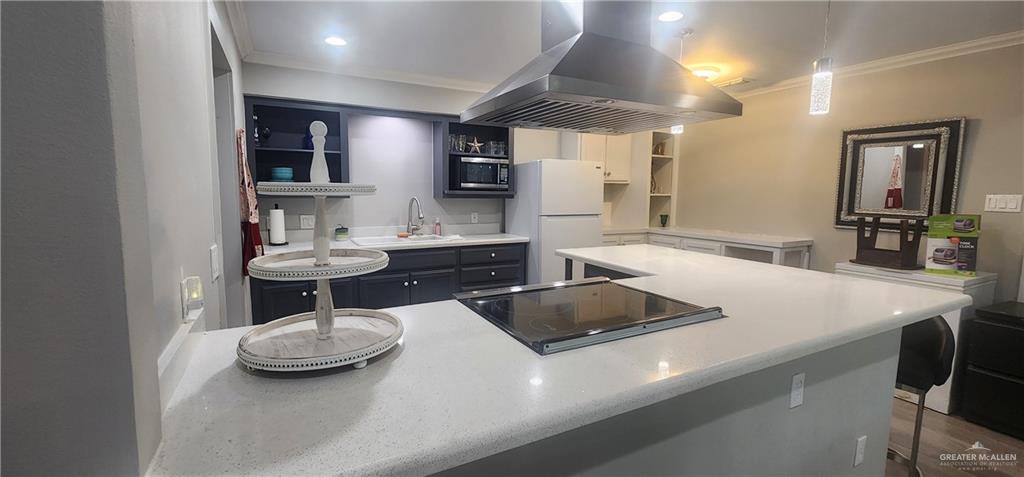 118 Keystone Street Mission, TX 78572 - Photo 2 of 11 a kitchen with a table chairs and stove