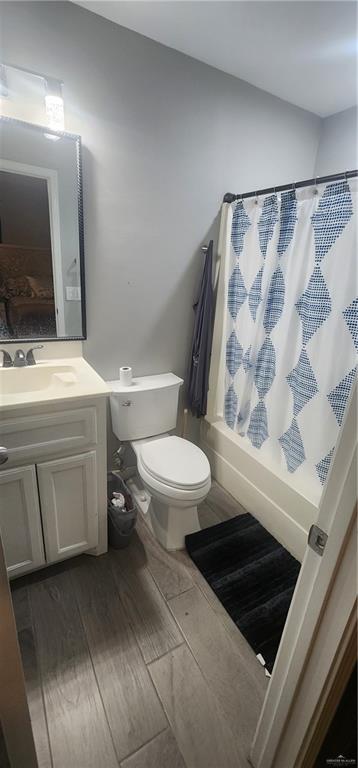118 Keystone Street Mission, TX 78572 - Photo 8 of 11 a bathroom with a toilet a sink and a mirror