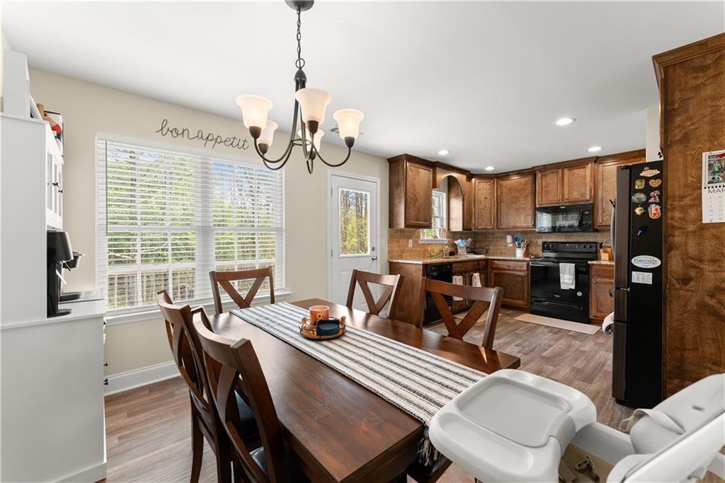 5430 Stepstone Way Gainesville, GA 30506 - Photo 11 of 39 a view of a dining room with furniture window and outside view