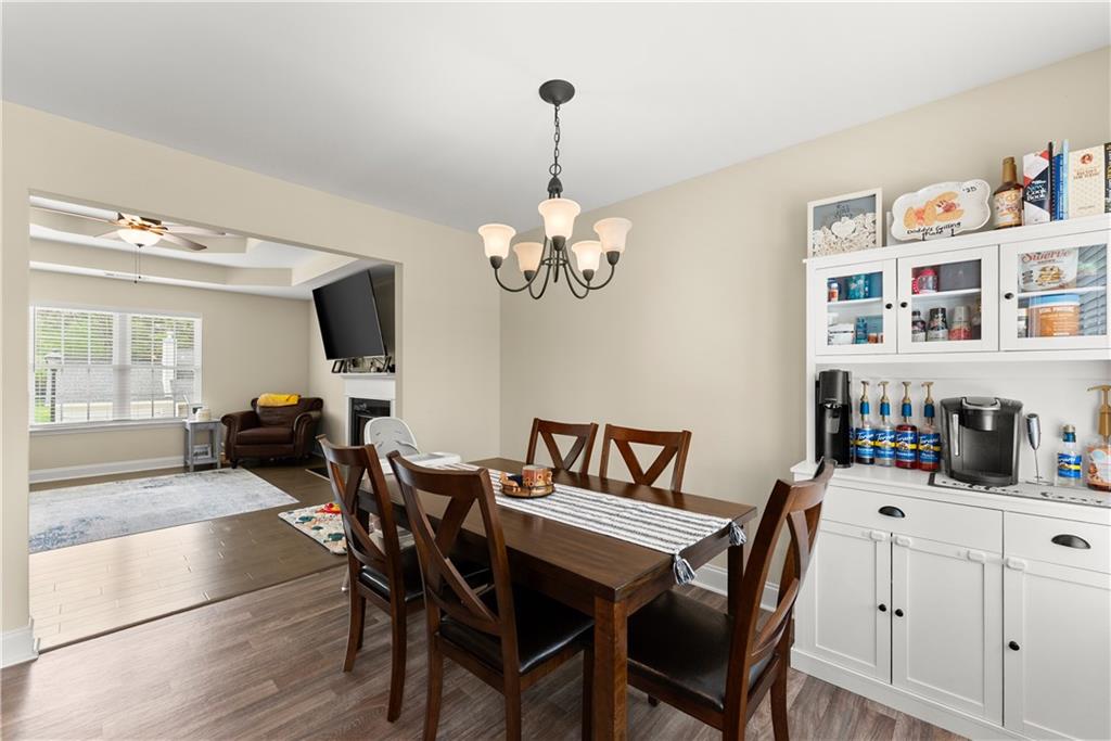 5430 Stepstone Way Gainesville, GA 30506 - Photo 16 of 39 a dining room with furniture and wooden floor